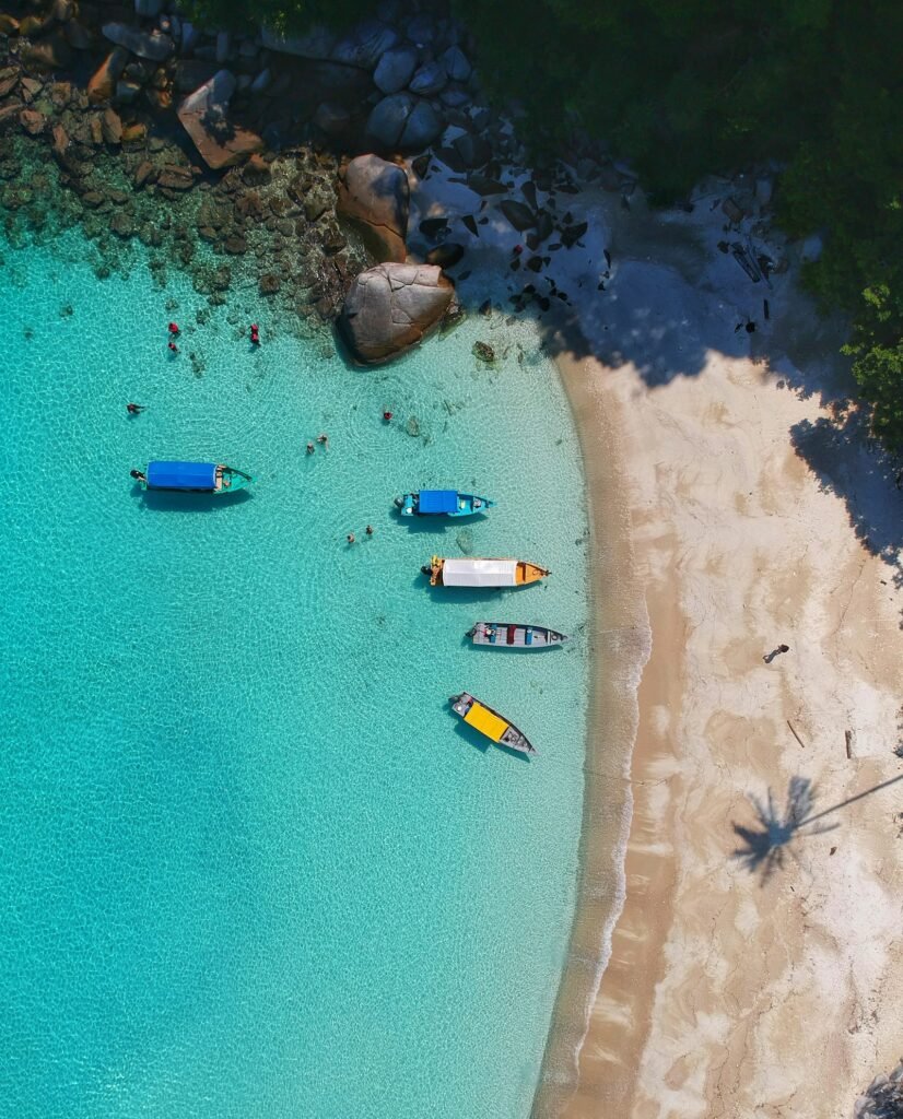 Turquoise sea meeting a sandy beach