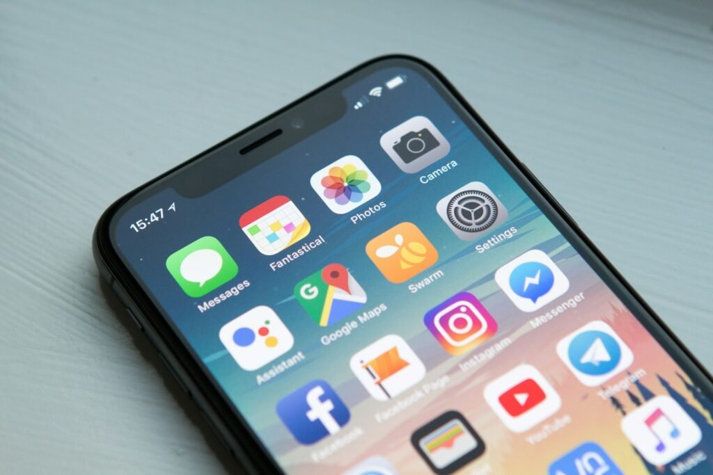 Smartphone showing maps and travel apps