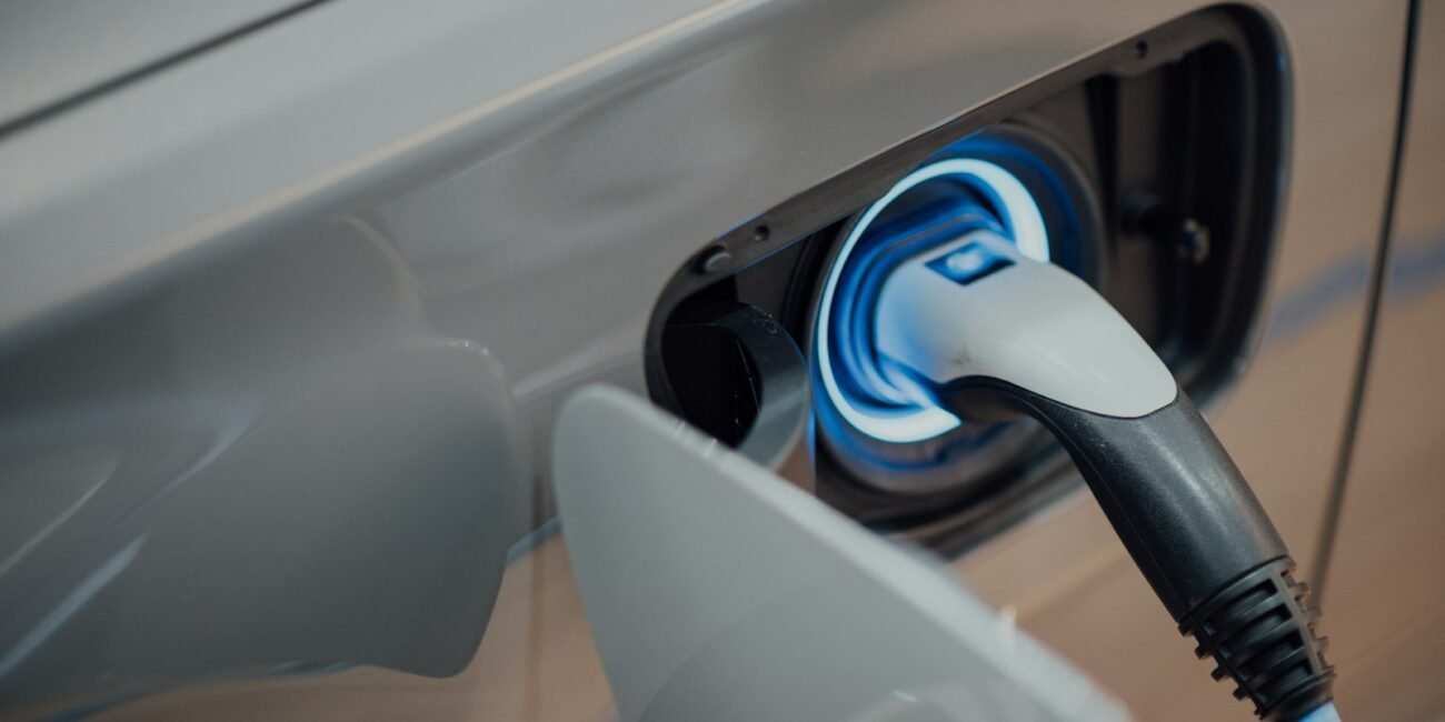 Electric car charging at a station