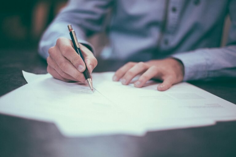 Person reviewing documents at a desk